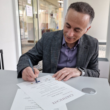 Signing course certificates at Macau Saint Joseph University’s Faculty of Business and Law