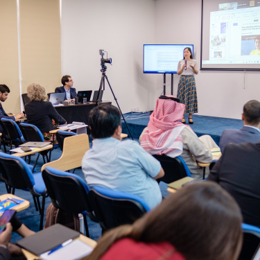 AI Ethics Manager giving a training to diverse participants