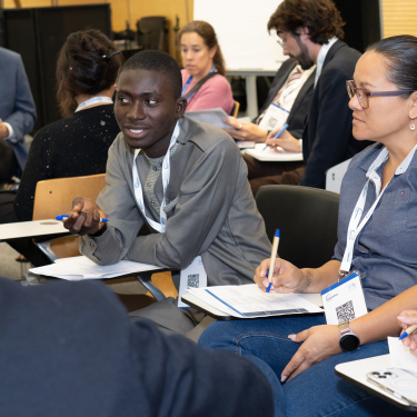 Diverse people talking in a problem-solving workshop