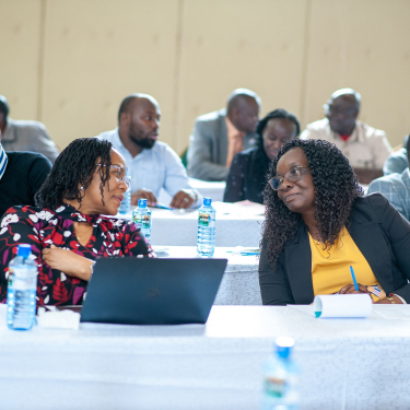 People chatting in a training workshop